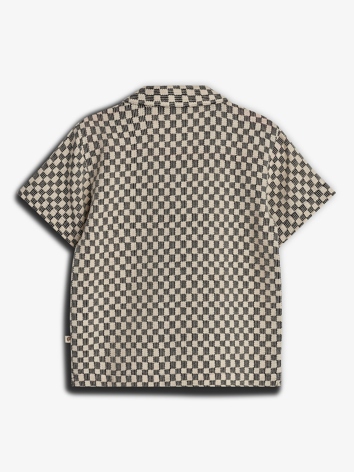 A short-sleeved shirt features a black and white checkered pattern, displayed flat to reveal the back design, set against a plain white background.