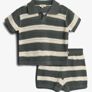 A knitted outfit features a short-sleeved collared shirt and shorts with green and white stripes. The label inside the shirt reads "pamelacute." Both pieces have a textured, open-knit design.